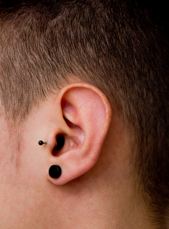 pierced ear of a young man