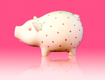 piggy money box on a pink backgroundの写真素材