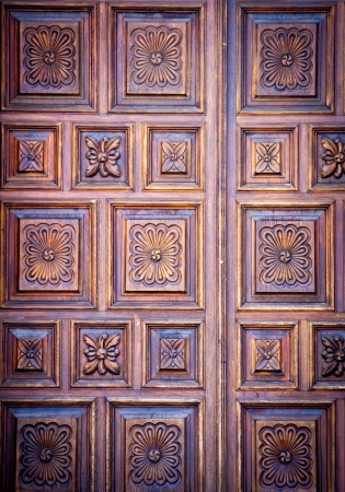 wooden door background with floral patternsの写真素材