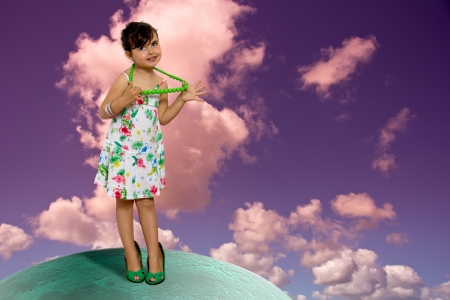 girl dressed with woman clothesの写真素材