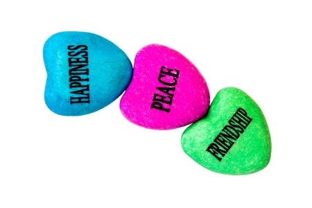 pink painted heart stone with peace word