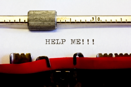 typewriter with the following text: help meの写真素材