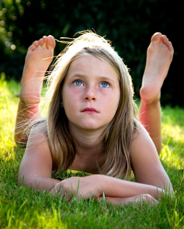 portrait of a little girl in a meadowの写真素材