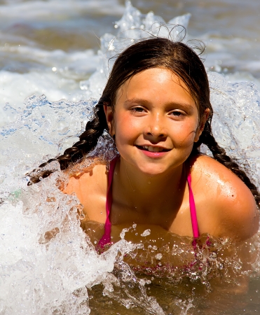 portrait of a little girl on the beachの写真素材