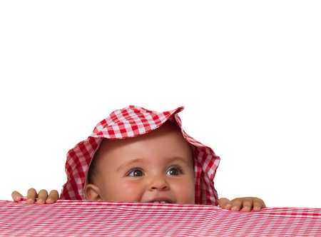 baby portrait with hat and checkered tableclothの写真素材