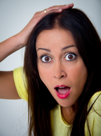 expressive woman on a gray backgroundの写真素材
