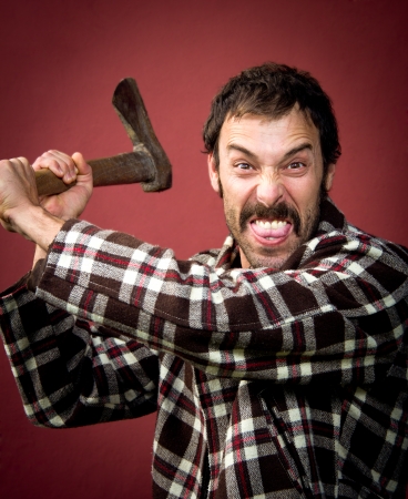 portrait of a woodcutter attackin with his axの写真素材