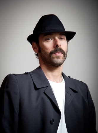 portrait of a middle aged man with gangster lookの写真素材
