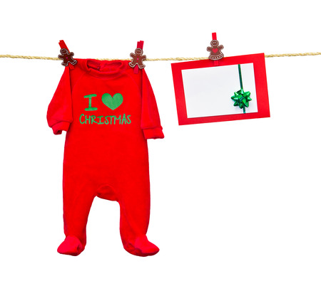 christmas card in clothesline isolated on whiteの写真素材