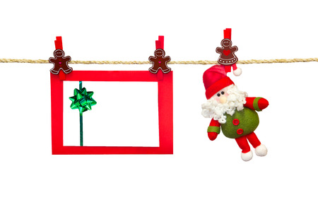 christmas card in clothesline isolated on whiteの写真素材