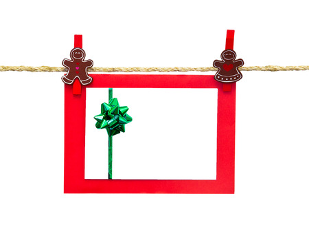 christmas card in clothesline isolated on whiteの写真素材