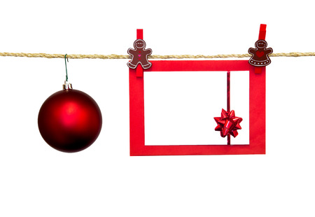 christmas card in clothesline isolated on whiteの写真素材