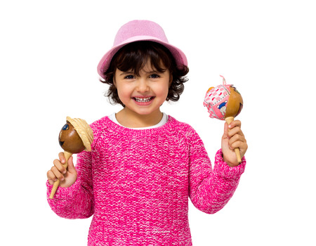 portrait of a little girl with a maracasの写真素材