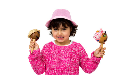 portrait of a little girl with a maracas