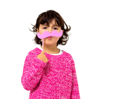 portrait of a little girl with a toy mustacheの写真素材