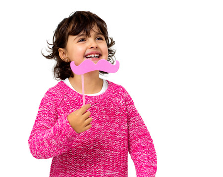 portrait of a little girl with a toy mustacheの写真素材