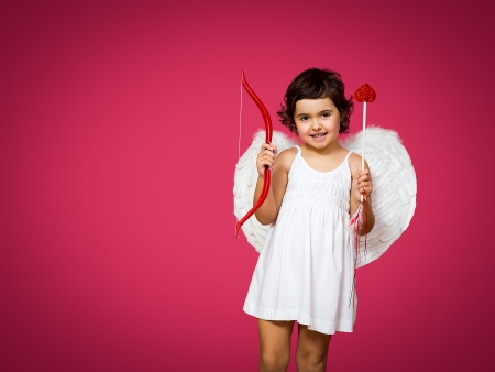 cupid little girl with a bow, arrow and wingsの写真素材