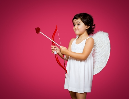 cupid little girl with a bow, arrow and wingsの写真素材