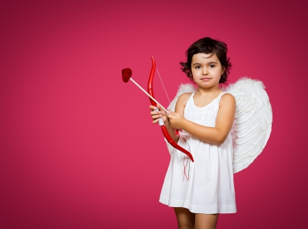 cupid little girl with a bow, arrow and wingsの写真素材