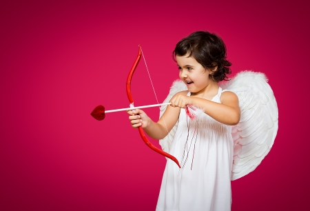 cupid little girl with a bow, arrow and wingsの写真素材