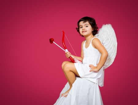 cupid little girl with a bow, arrow and wingsの写真素材