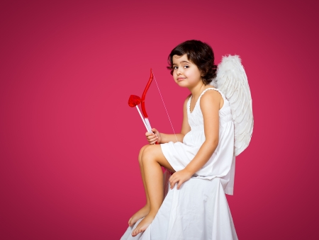 cupid little girl with a bow, arrow and wingsの写真素材