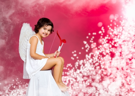 cupid little girl with a bow, arrow and wingsの写真素材