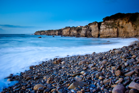 View of a rocky coast in the sunsetの写真素材