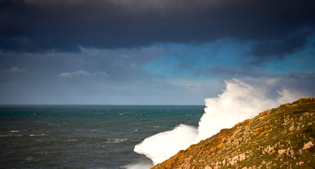 View of waves at rocky coastの写真素材