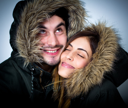 Young couple isolated on white. Studio shot.の写真素材