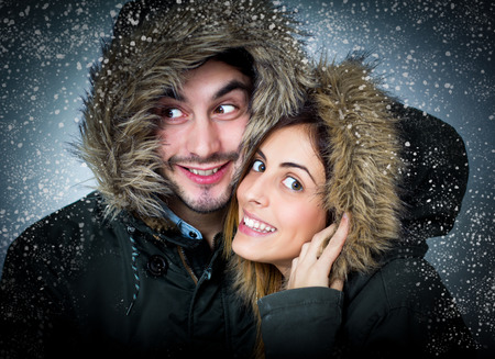 Young couple in the snow.の写真素材