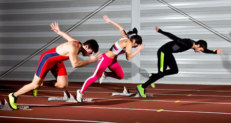 sprint start in track in blurred motionの写真素材