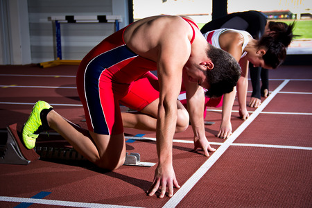 Athletes on sprint start trainingの写真素材