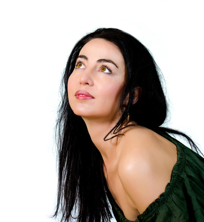 Portrait of a beautiful woman with black hair and green eyesの写真素材