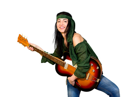 Woman posing with an electric guitarの写真素材