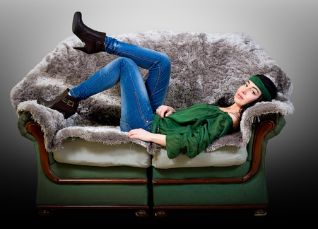 sexy woman lying on a couchの写真素材