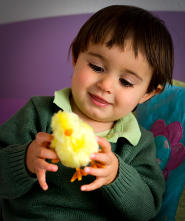 Portrait of a little child in bedroomの写真素材