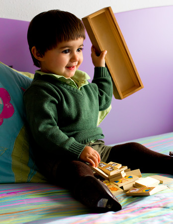 Portrait of a little child in bedroomの写真素材