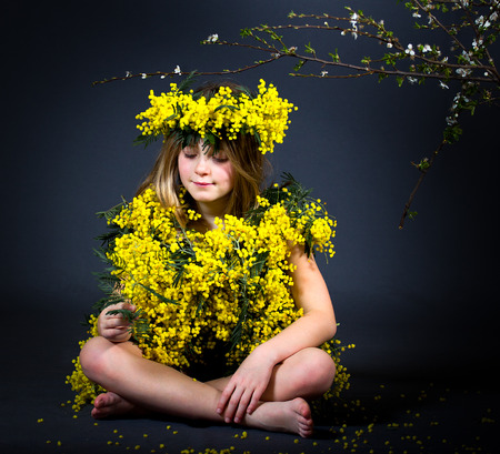 Portrait of a little girl with floral dress.の写真素材