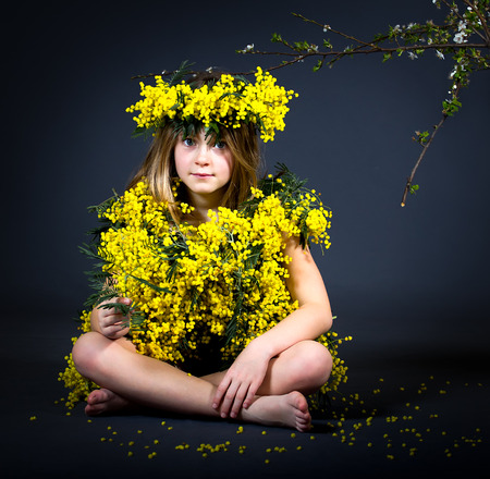 Portrait of a little girl with floral dress.の写真素材