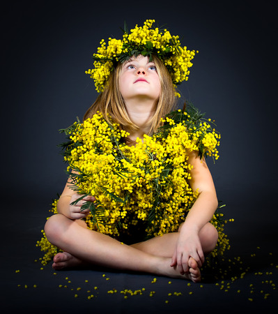 Portrait of a little girl with floral dress.の写真素材