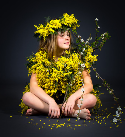 Portrait of a little girl with floral dress.の写真素材