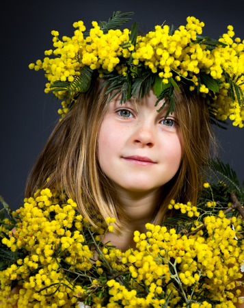 Portrait of a little girl with floral dress.の写真素材