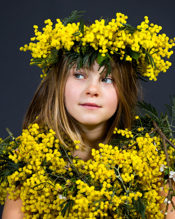 Portrait of a little girl with floral dress.の写真素材