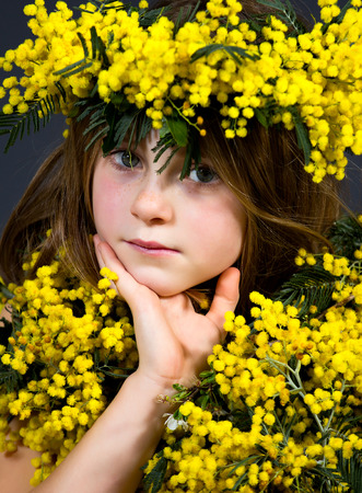 Portrait of a little girl with floral dress.の写真素材