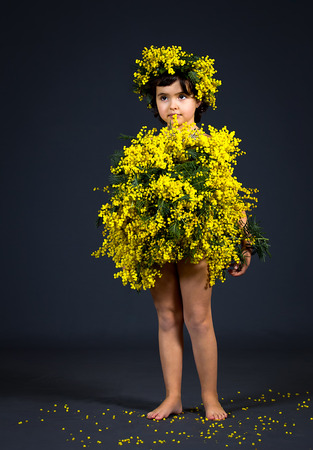 Portrait of a little girl with floral dress.の写真素材