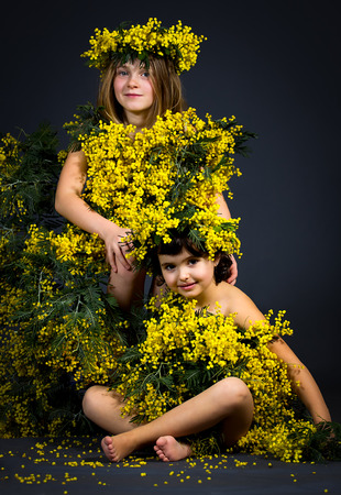 Portrait of two little girls with floral dress.の写真素材
