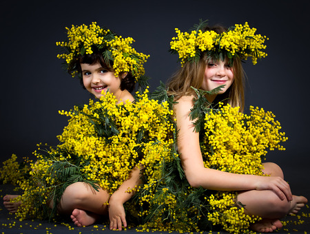 Portrait of two little girls with floral dress.の写真素材