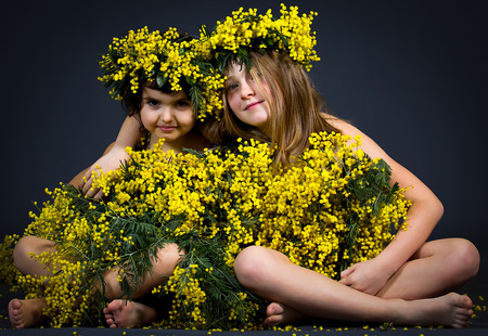 Portrait of two little girls with floral dress.の写真素材