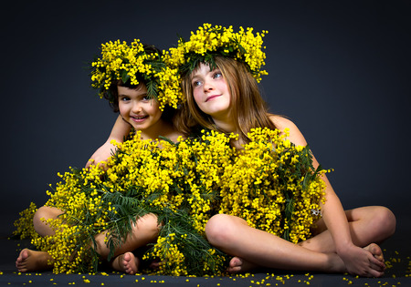 Portrait of two little girls with floral dress.の写真素材